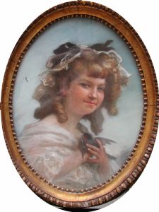 Bel dipinto acquarelli su carta Figura di giovane donna con usignolo. Siglato e datato 1809.Bella cornice ovale cm.50x40